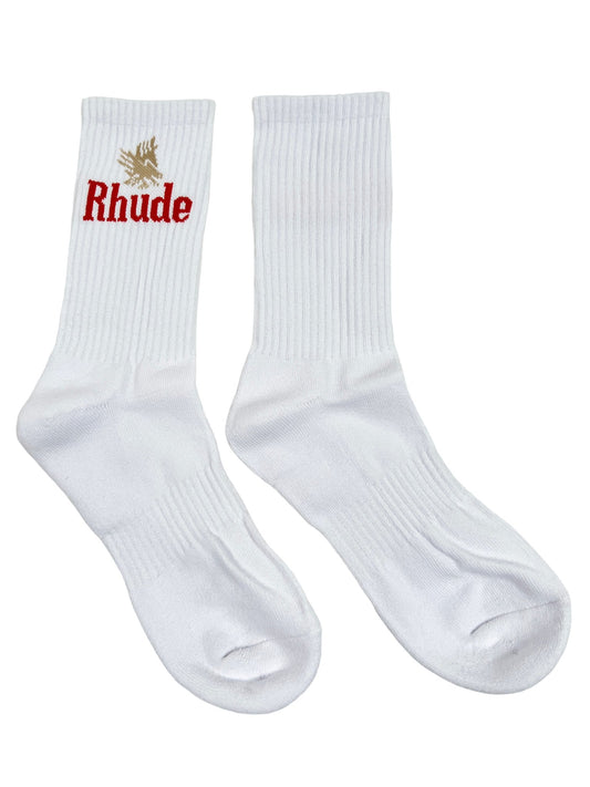 A pair of high-quality material white socks with the RHUDE EAGLES SOCK WHITE/RED on them.