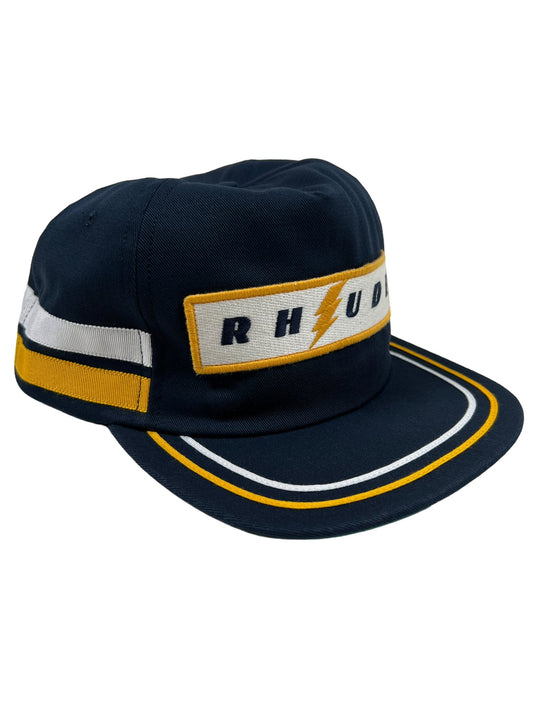 A navy and yellow RHUDE LIGHTING PANEL hat with the word "RHU" on it, crafted from high-quality materials.