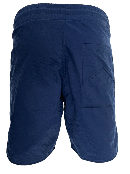 The back view of a men's RHUDE LOGO TRACK-SHORT NAVY swim shorts with an elasticated waistband.