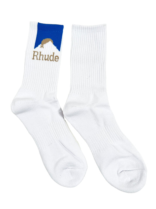 A pair of white cotton socks with the word RHUDE MOONLIGHT SOCK WHITE/BLUE on them.