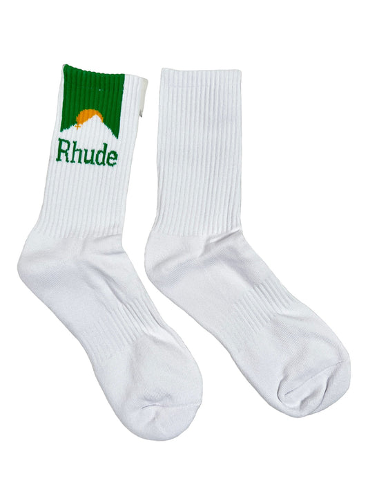 A pair of white RHUDE Moonlight socks with a green logo on them, made of cotton and spandex.