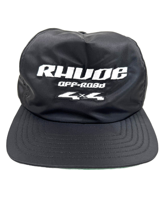 A black RHUDE NYLON 4X4 hat with the word RHUDE embroidered on it.