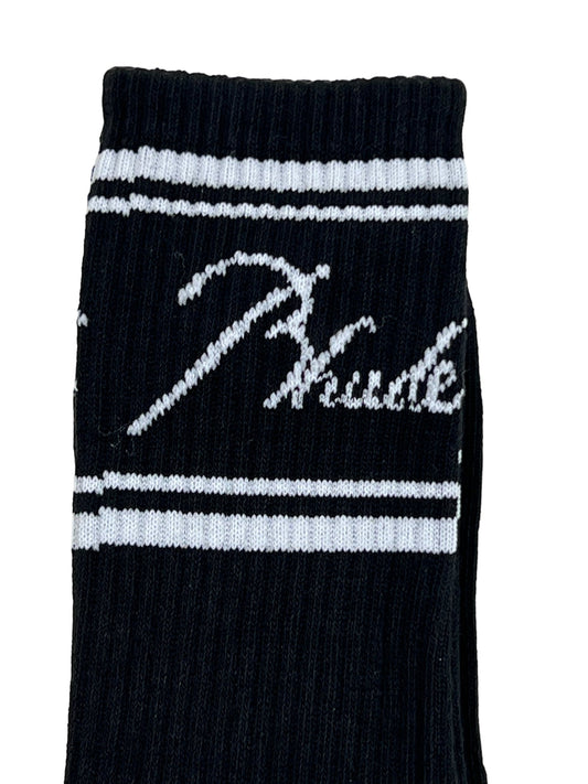 A pair of black and white polyester Rhude SCRIPT LOGO socks with the word phuse on them.