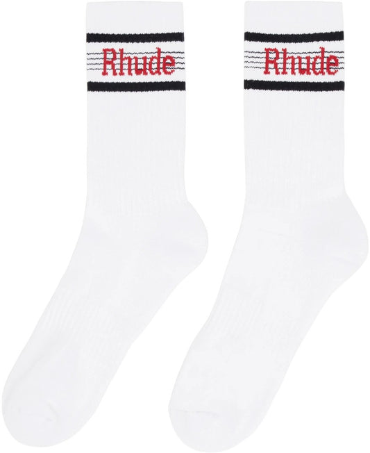 A pair of white RHUDE SPEED STRIPE SOCK WHT/BLK/RED featuring a jacquard logo "RHUDE" on them, made from stretch knit fabric.