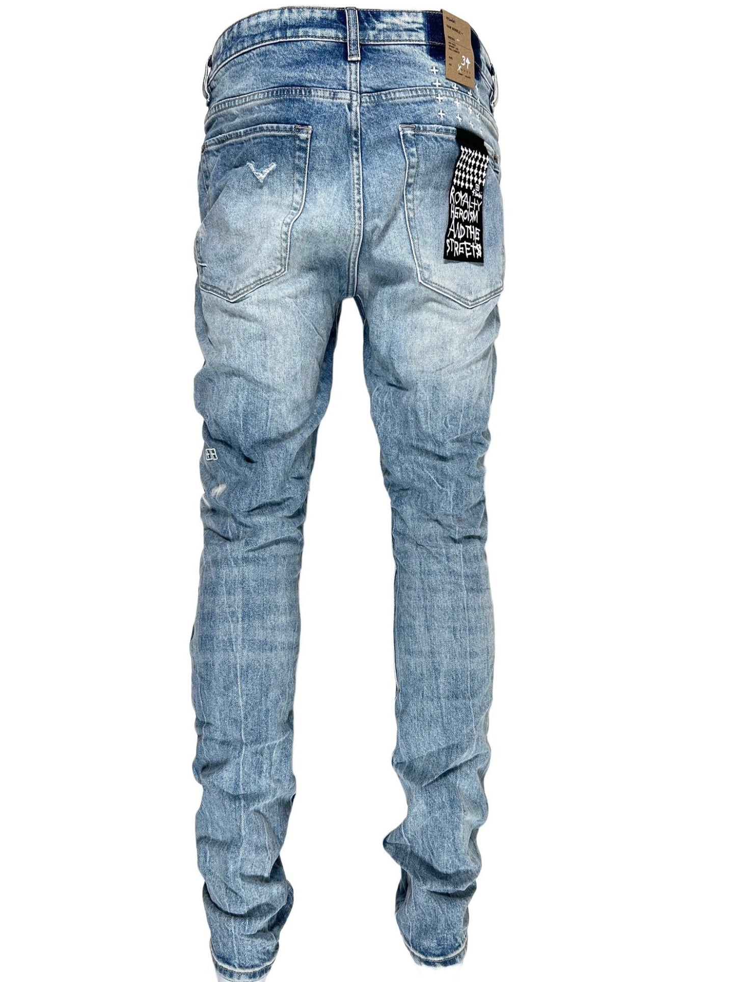The back view of a pair of blue skinny fit KSUBI VAN WINKLE HIGHFLY DENIM jeans.