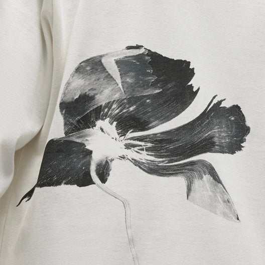 A white ADIDAS x Y-3 long sleeve graphic t-shirt with a black flower on it.