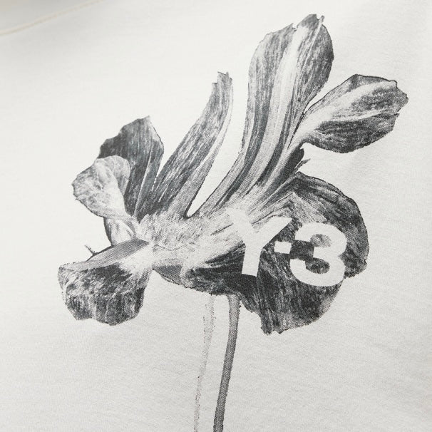 A white Y-3 long sleeve t-shirt with an image of a flower on it.
