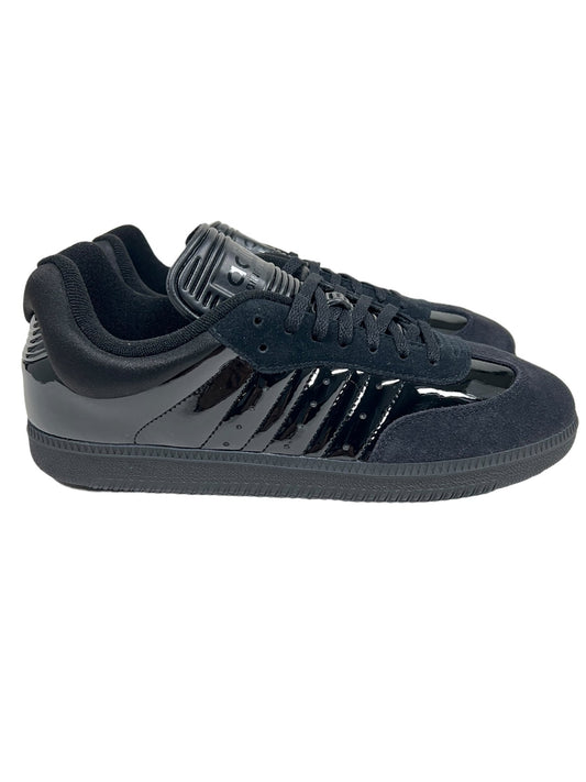 A pair of black ADIDAS x DINGYUN ZHANG IE3176 DYZ SAMBA CBLACK GUM5 shoes with shiny patent leather and suede detailing, displayed on a white background.