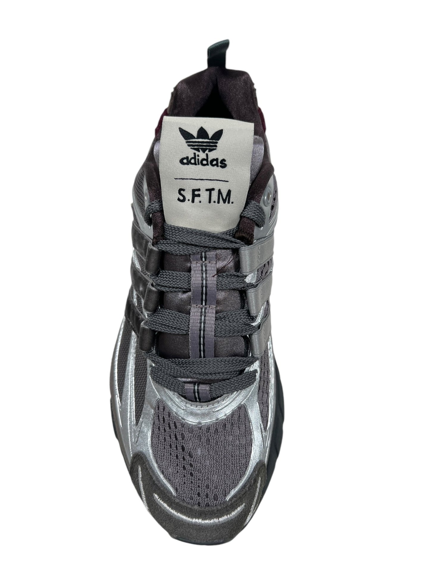 A single gray and black Adidas X Song For The Mute Jh9009 Adistar Cushion Sft Taume sneaker, showcasing a white tongue with the "ADIDAS x SONG FOR THE MUTE" logo, features a traction outsole for superior grip, ensuring it is one of the most comfortable trainers suitable for any activity.