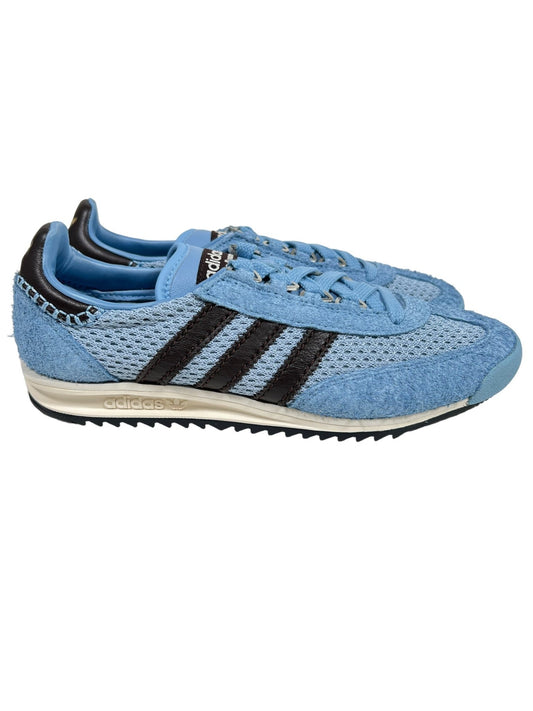 Light blue ADIDAS x WALES BONNER IH3262 WB SL76 sneaker with dark blue stripes and textured detailing, pictured against a white background.