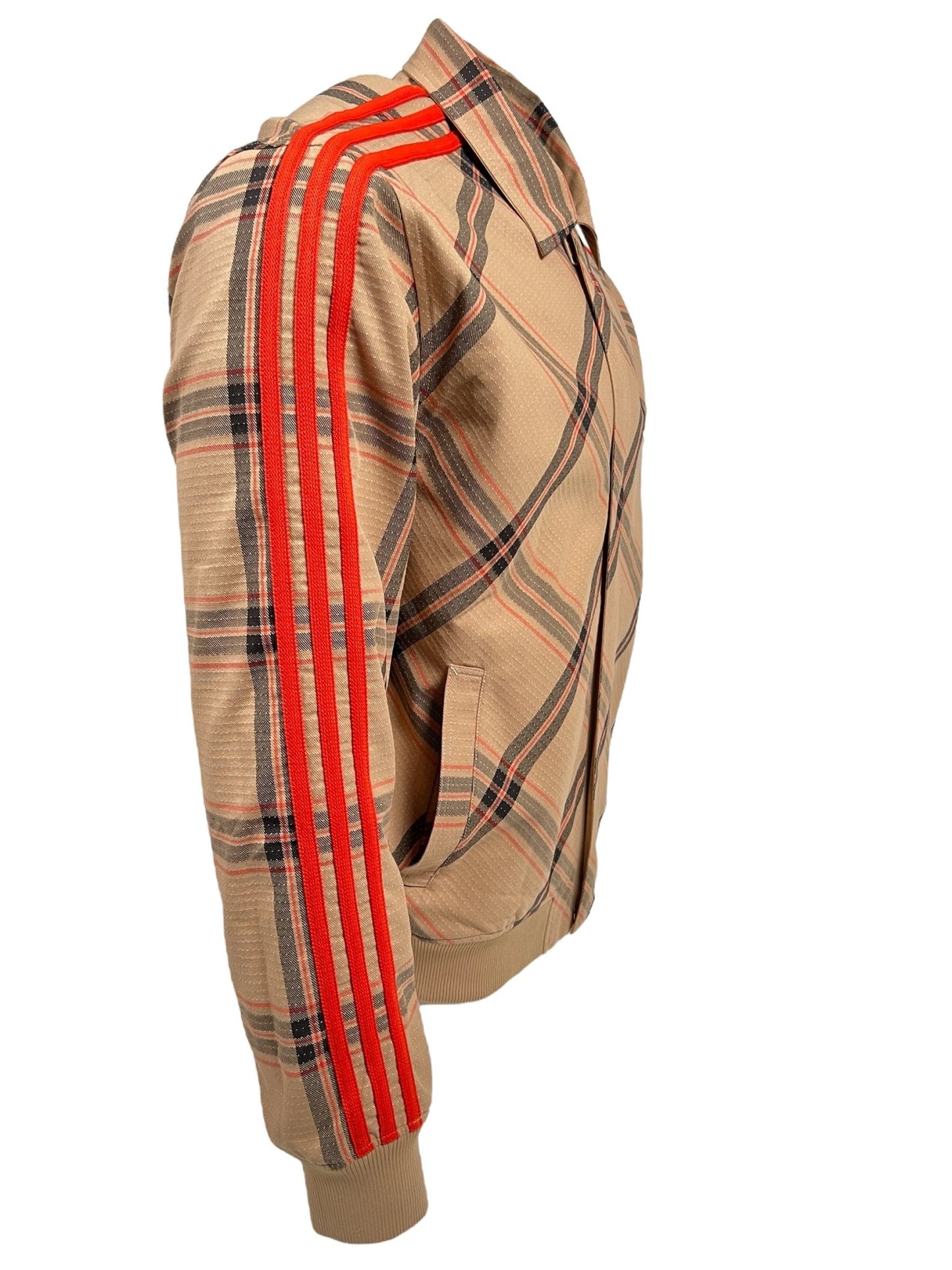 Side view of a beige plaid ADIDAS X WALES BONNER IW3601 WB RVRSBL HARRI BEIGWB reversible jacket with red and black stripes on the sleeves, displayed on a white background.