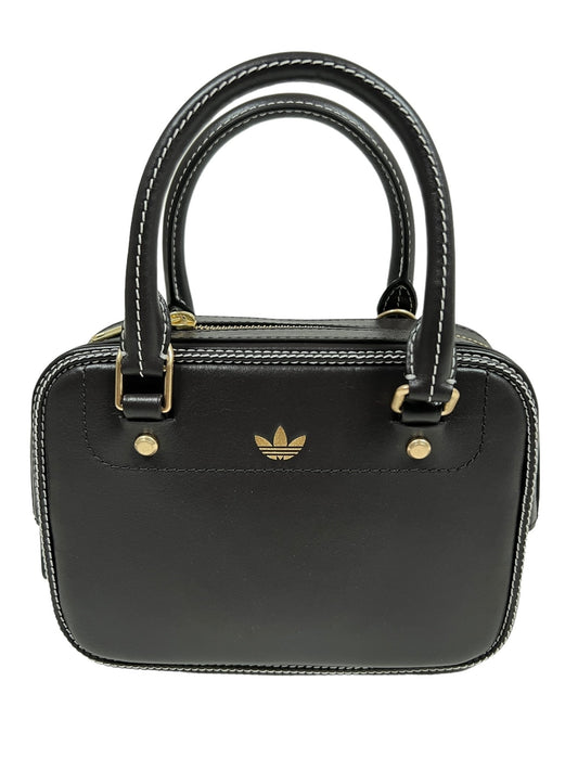 A small black ADIDAS x WALES BONNER handbag with twin handles, gold accents, and a front Wales Bonner adidas logo on a white background.