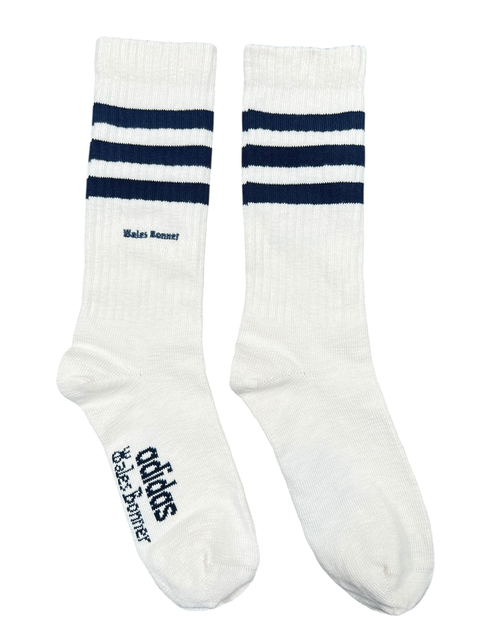 The Adidas x Wales Bonner JV8684 WB 3S Sock NtNavy features a classic white crew style with two navy stripes and black "Wales Bonner adidas" text, showcasing the signature blend of both brands' iconic designs.