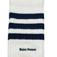 The ADIDAS x WALES BONNER JV8684 WB 3S Sock NtNavy is a white sock with three navy stripes and "Wales Bonner" embroidered by the ankle.