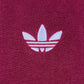 The Adidas x Wales Bonner JW1122 WB Terry Polo Cburg features a white Adidas Trefoil logo embroidered on textured maroon fabric, adding retro flair and sporty elegance to your style.