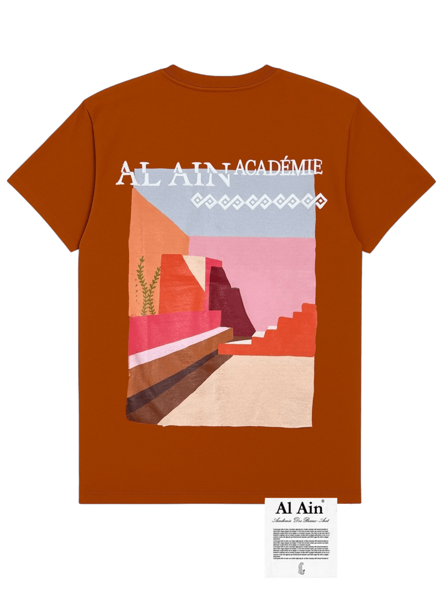The Al Ain AMHX-S820 Almas T-shirt Ambra by AL AIN is a rust-colored, 100% cotton shirt with abstract desert art and "AL AIN ACADÉMIE" text on the back. Features a branded tag and is made in Italy for quality and comfort.