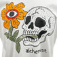 The Alchemist Floral Skull Tee 2 White from ALCHEMIST showcases a bold design featuring a skull and flower, complemented by a vintage washed finish for an effortlessly edgy vibe.