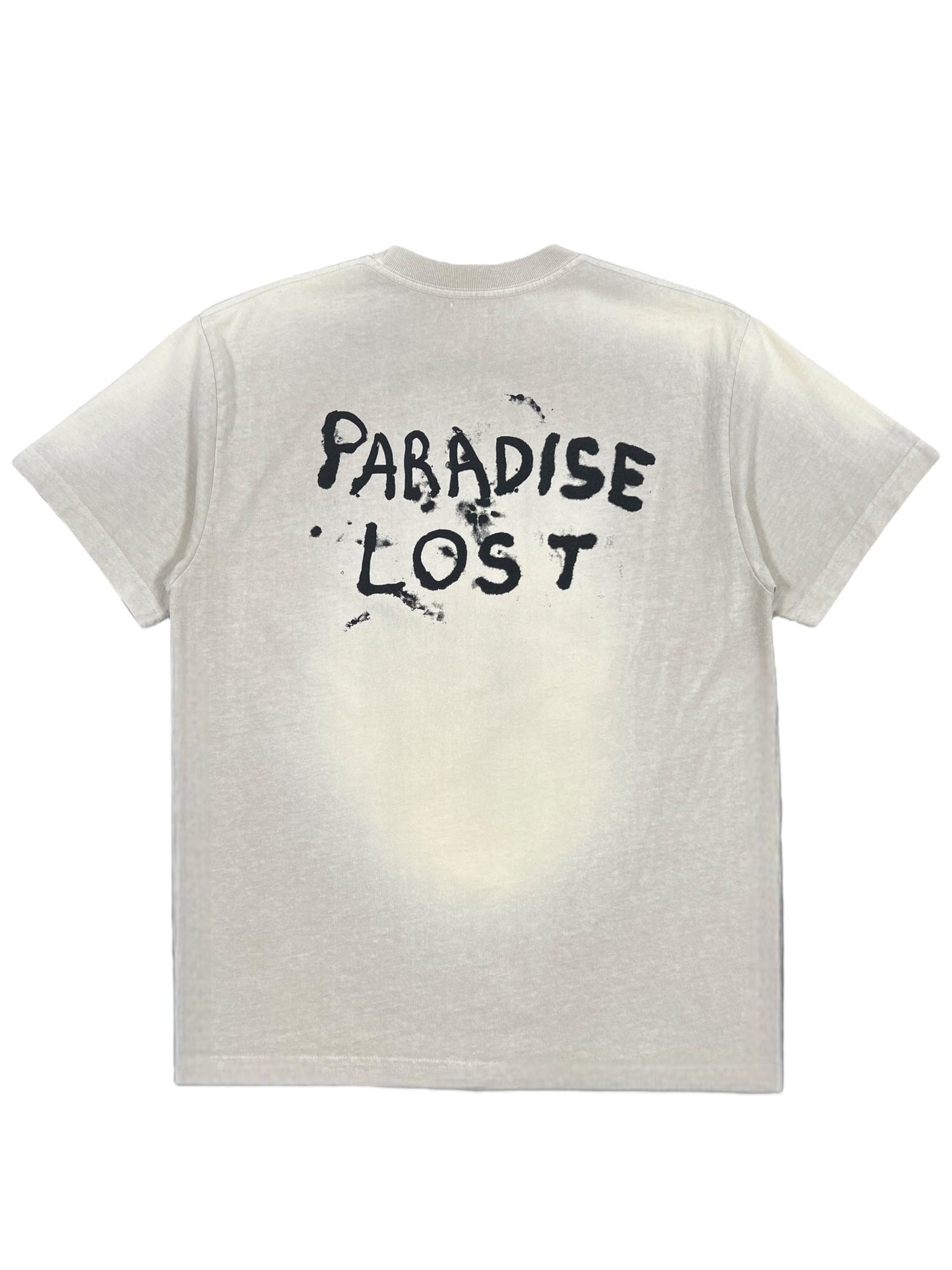 The ALCHEMIST LOST SKULL TEE JET STREAM, a beige vintage washed 100% cotton T-shirt, showcases the text "PARADISE LOST" in a black, slightly distressed font on the back, making it a distinctive graphic tee from ALCHEMIST.