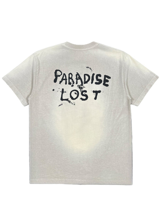 The Alchemist Lost Skull Tee Jet Stream by ALCHEMIST is a vintage washed white graphic T-shirt, featuring "PARADISE LOST" in bold, black distressed letters on the back. It's expertly crafted from 100% cotton for ultimate comfort and style.