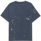 Explore edgy fashion with the Domrebel Atelier Pocket Tee in dark blue by DOM REBEL, showcasing a bold paint splatter design on the front and back.