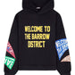 BARROW's Barrow F4bwuahs043 Hoodie Nero/Black features "WELCOME TO THE BARROW DISTRICT" in yellow on the front. It's made of 100% cotton with multicoloured print patches in red, green, and blue on the sleeves with similar text.