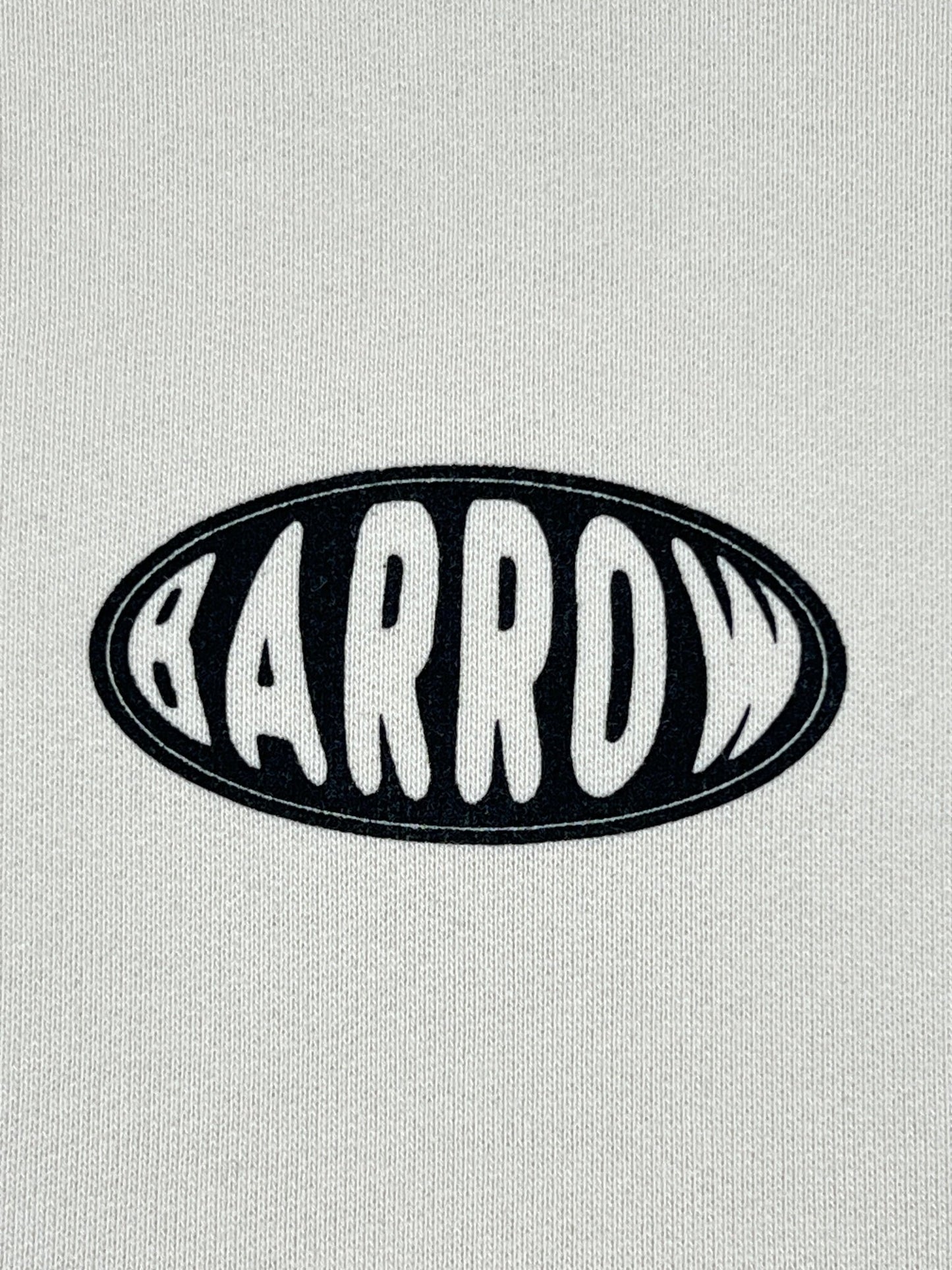 The image showcases the BARROW logo in bold black and white on a stylish unisex vanilla hoodie, echoing the sleek designs typical of trendy graphic hoodies.