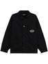 The BARROW S5BWUAJK065 Jacket Unisex Nero/Black is an urban-style nylon jacket featuring a pointed collar, front pockets, button-up closure, a green logo patch on the chest, and a small green smiley face button.