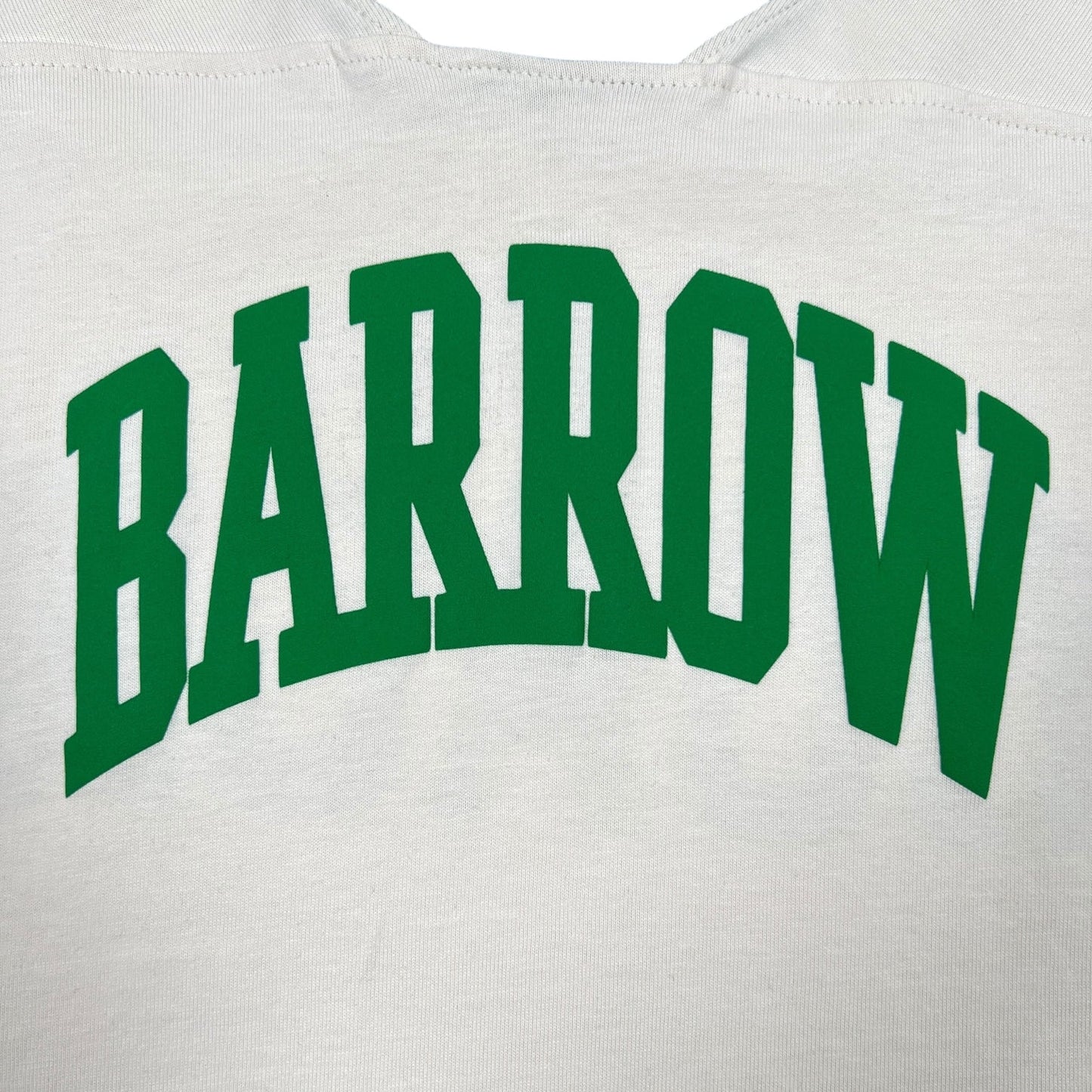 The Barrow S5BWUATH032 Jersey T-shirt Vanilla by BARROW is a crisp white 100% cotton tee featuring "BARROW" in bold green letters on the back, reminiscent of a classic Barrow football jersey.