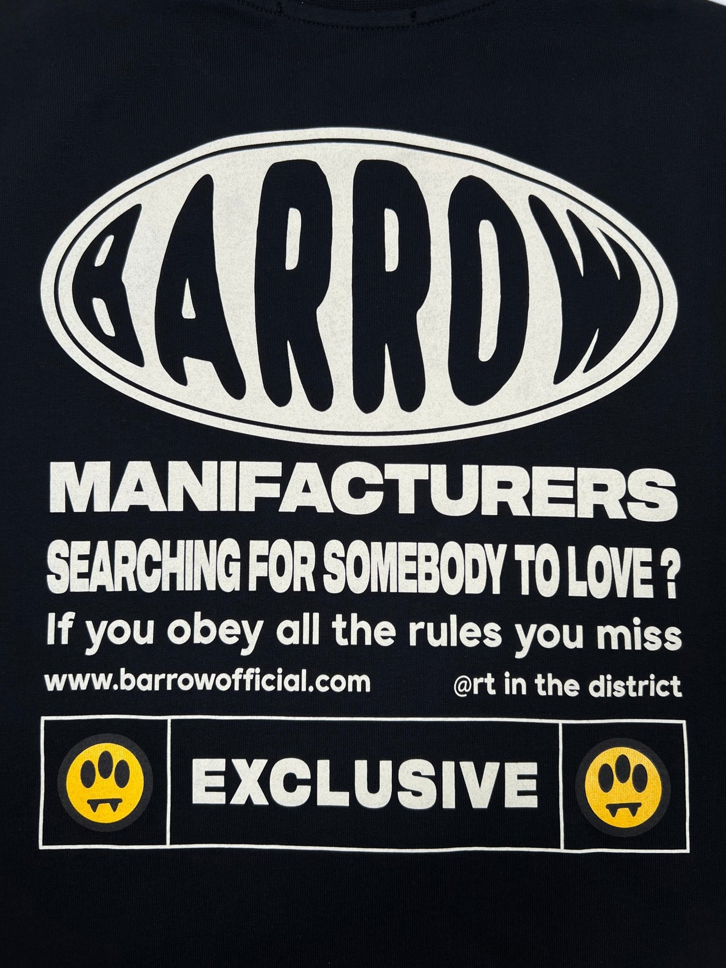 The Barrow S5BWUATH066 Jersey T-shirt in black features a graphic design with the BARROW logo and text: "MANUFACTURERS SEARCHING FOR SOMEBODY TO LOVE? If you obey all the rules you miss." It's crafted from 100% cotton and made in Italy. Website and social media handle are displayed.