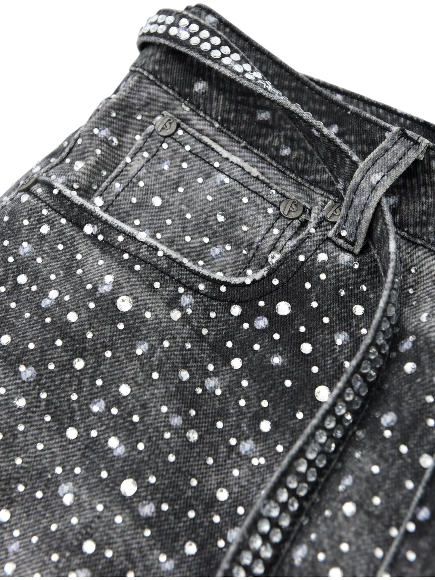 Close-up of BIRTH OF ROYAL CHILD Birth Of Royal Child BC24FWPT06 Diamond Boro Black jeans, crafted from 100% cotton with white paint splatter and rhinestone details on the pocket, belt loop, and side seam.