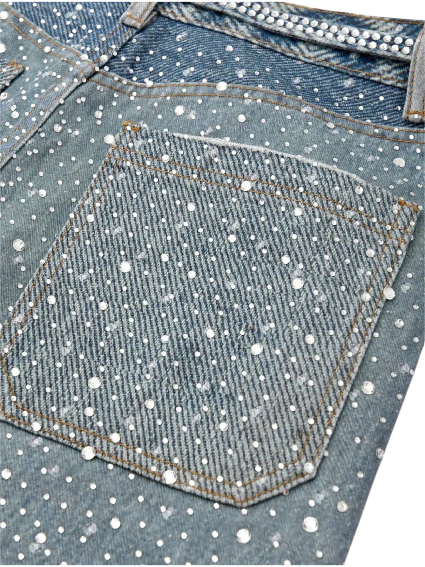 Close-up of the BIRTH OF ROYAL CHILD Birth Of Royal Child BC24SSPT05 Diamond Boro In Blue jeans, featuring a back pocket adorned with pearls and rhinestones on luxurious Japanese cotton—vintage 501-inspired with a sparkling touch.