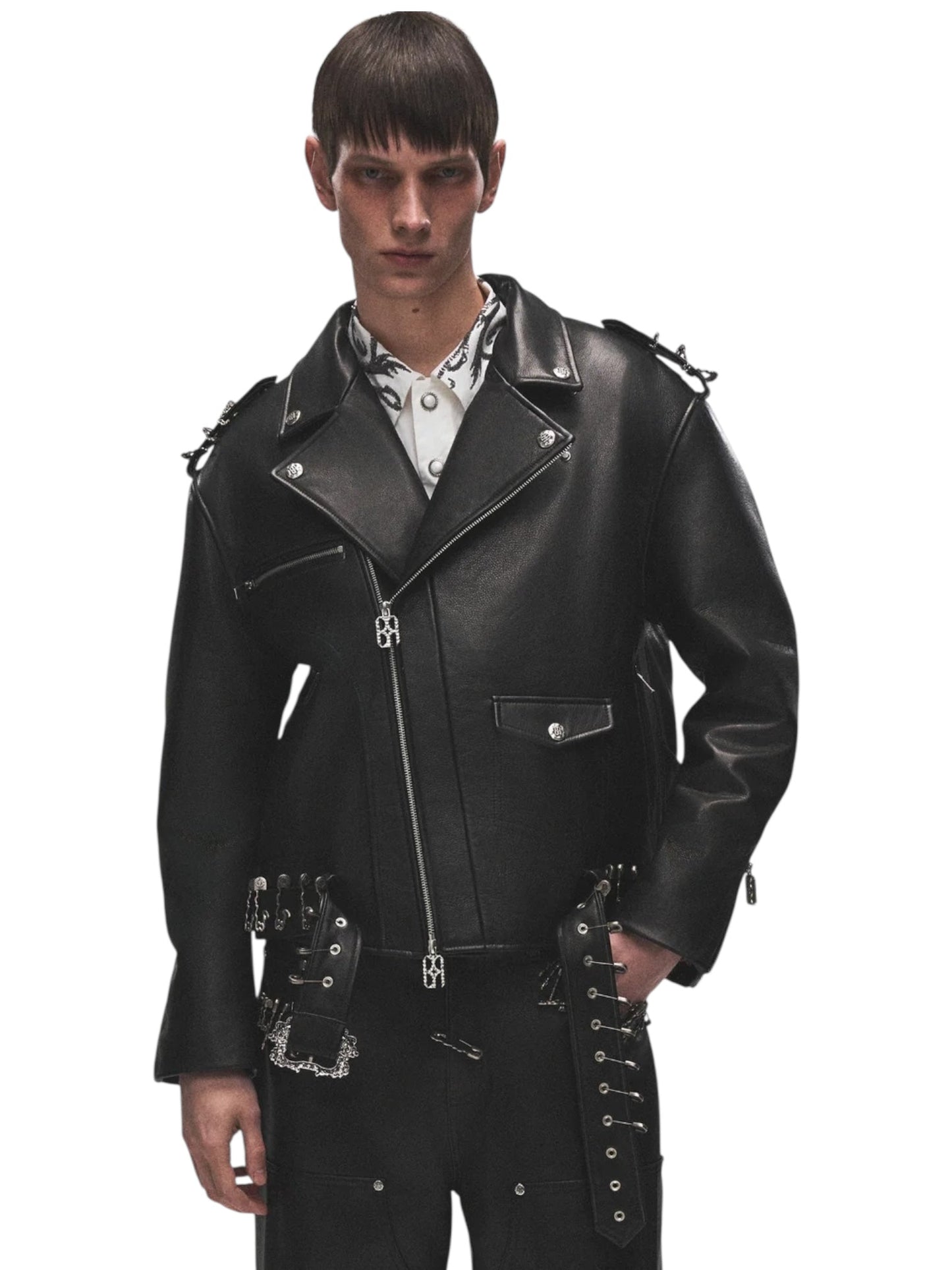 A person wearing the BIRTH OF ROYAL CHILD Birth Of Royal Child BC25SSJK09 Pin Detail Leather Jacket in black over a white patterned shirt, standing against a plain white background.