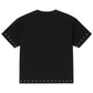 The BLDG4 Polished SS Knit Black tee by BLDG4 is made from 100% cotton, featuring silver stud accents and pearl rivets on the sleeve edges and hem, displayed against a plain white background.