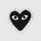 The COMME DES GARCONS X PLAY P1T801 T-SHIRT features a black embroidered heart-shaped patch with white eyes, outlined in shiny rhinestones, set on a plain white background.