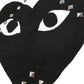 The Comme des Garcons P1T804 T-SHIRT LOGO STUD WHITE by COMME DES GARCONS X PLAY features a black heart-shaped logo with eye cutouts and silver square studs on white 100% cotton—ideal with your favorite CDG tee.