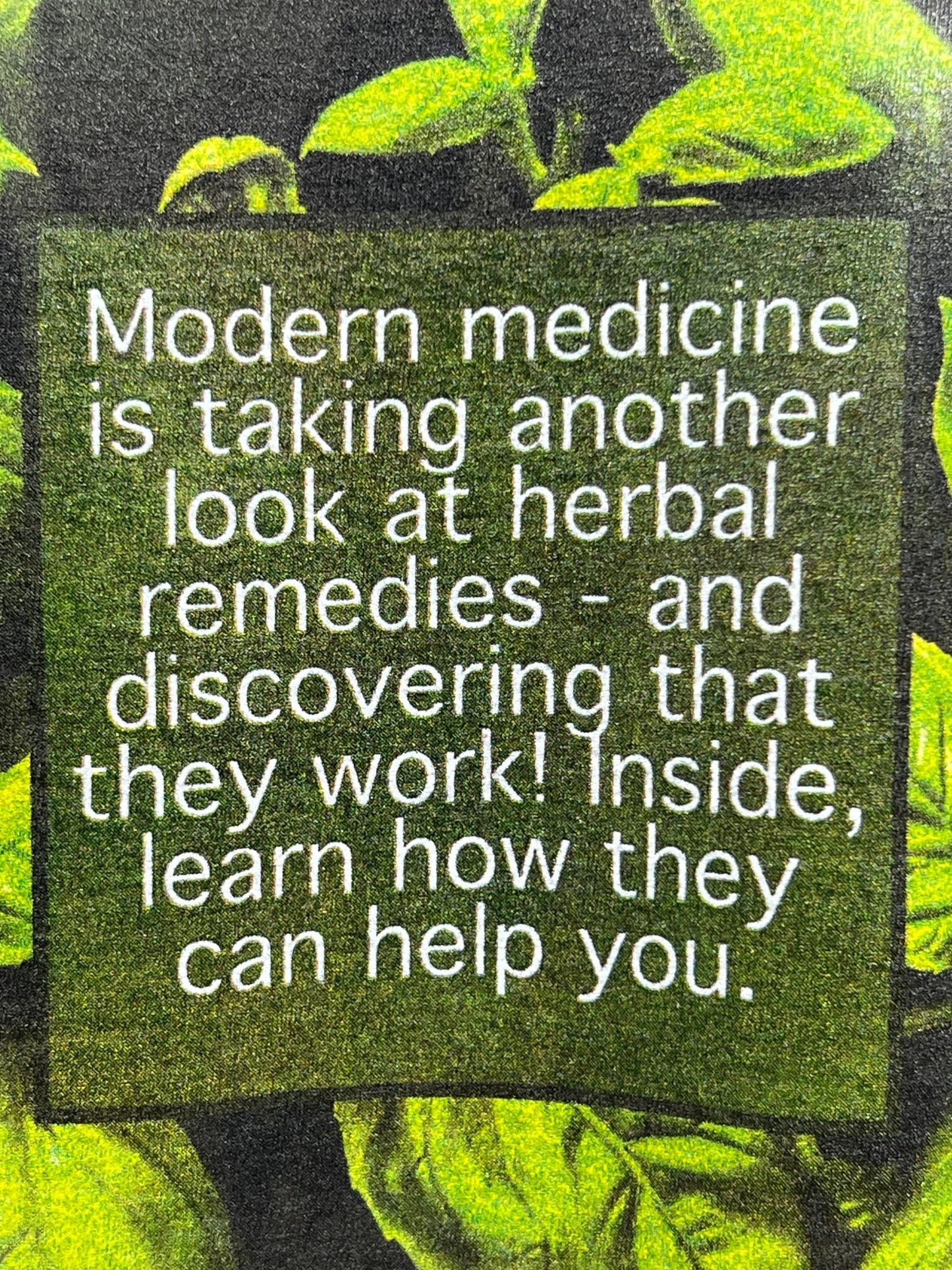 Text reads: "Modern medicine is taking another look at herbal remedies - and discovering that they work! Inside, learn how they can help you." Green leaves are in the background, highlighted by the CRTFD AYURVEDIC T-SHIRT BLACK made from organic cotton.