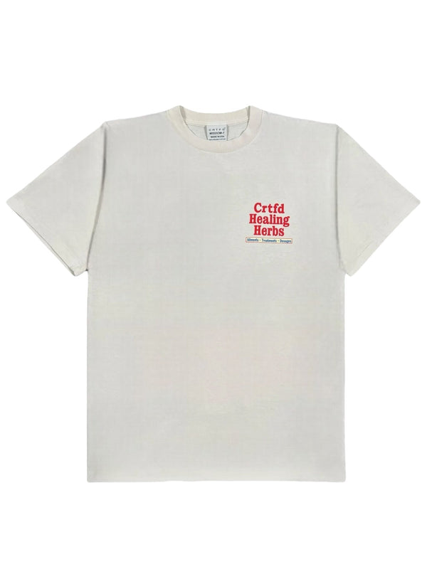 The CRTFD Ayurvedic T-Shirt Natural, made from soft organic cotton, showcases the phrase "Crtfd Healing Herbs" in striking red. Its beige color offers a stylish and natural touch.