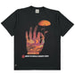 The CRTFD FLY AGARIC T-SHIRT VINTAGE BLK is a black T-shirt made from organic cotton, showcasing a colorful hand holding a mushroom and the text "CRTFD PSYCHEDELIC RESEARCH GROUP" underneath.
