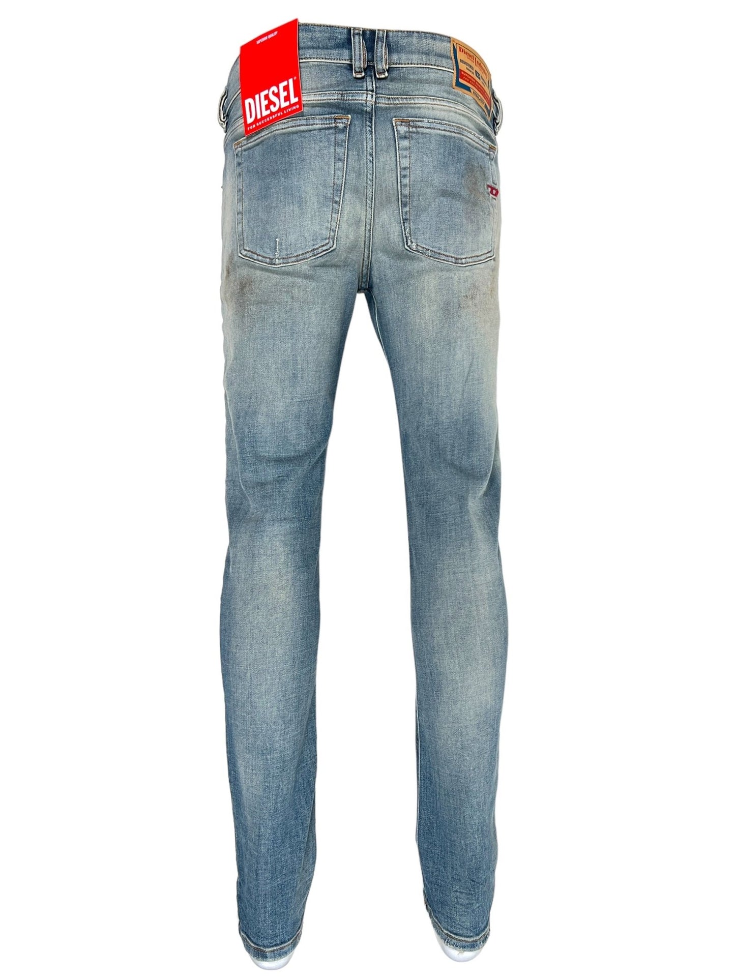 Rear view of the DIESEL 1979 SLEENKER 9J25 jeans in light blue with a red "DIESEL" label on the waistband. Crafted from organic cotton denim, these jeans feature visible stitching and a straight-cut leg style, highlighting Diesel's DNA washes for that vintage-inspired look.