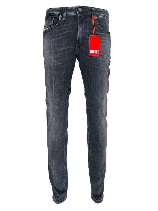 A pair of DIESEL 1979 SLEENKER PFAX skinny jeans with a red tag displayed on a white background.