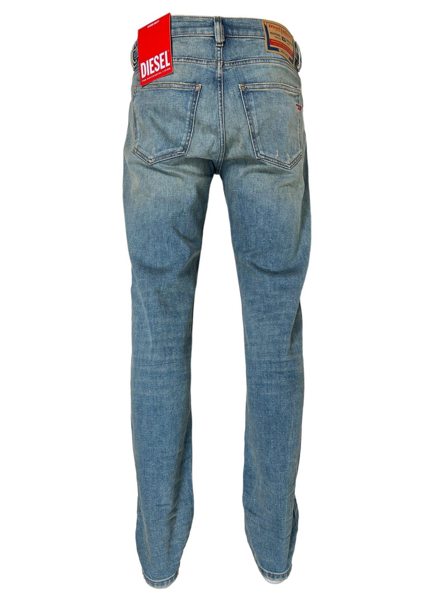 A pair of DIESEL 2019 D-STRUKT 9H50 DENIM shown from the back, featuring two rear pockets and a red Diesel tag on the waistband, crafted with recycled cotton.