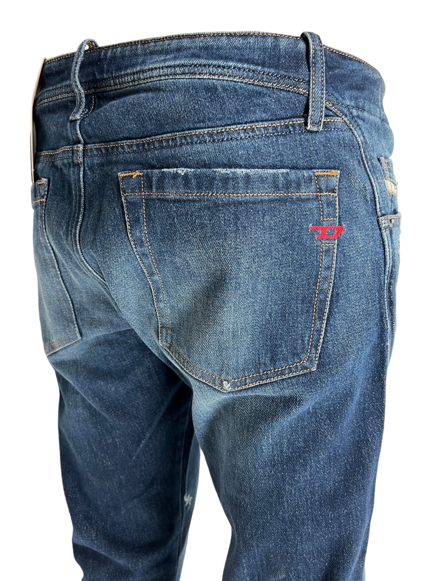 Introducing the Diesel D-Backler 9J56: Dark blue bootcut jeans featuring visible back pockets and contrast stitching, made from comfort denim that captures the unique DNA of DIESEL.