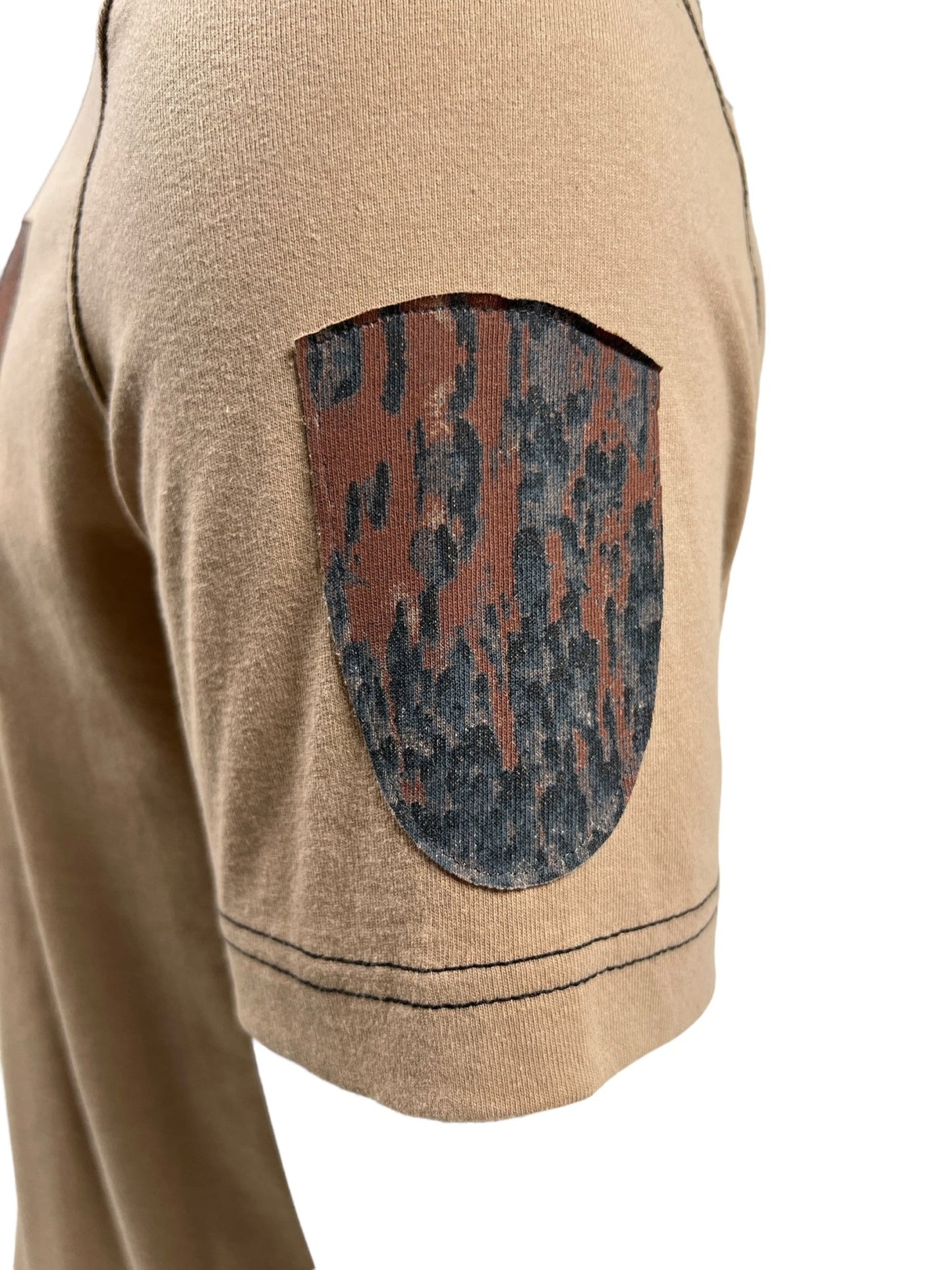 Close-up of the DIESEL T-ADJUST-Q1 T-SHIRT 72S, a brown men’s cotton regular fit T-shirt by DIESEL, featuring a camouflage printed jersey patch on the sleeve.