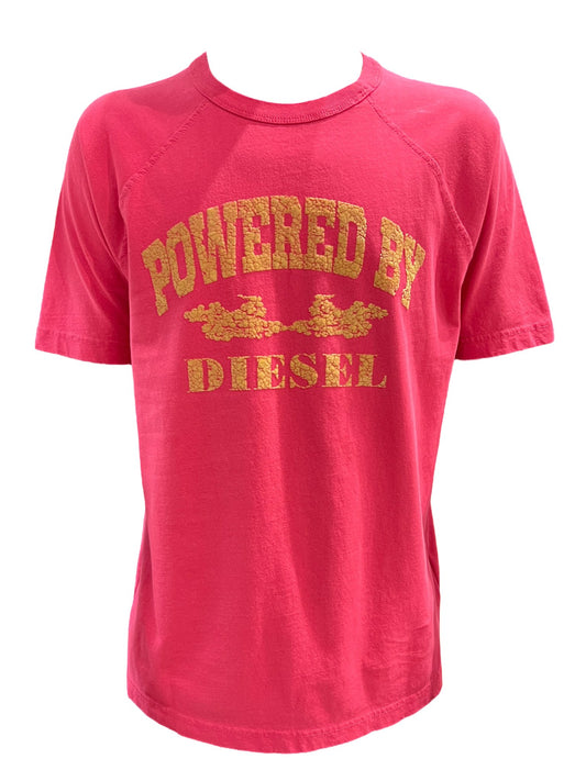 A pink, 100% cotton DIESEL T-RUST T-SHIRT BABY PINK with the phrase "powered by DIESEL" printed in gold letters.