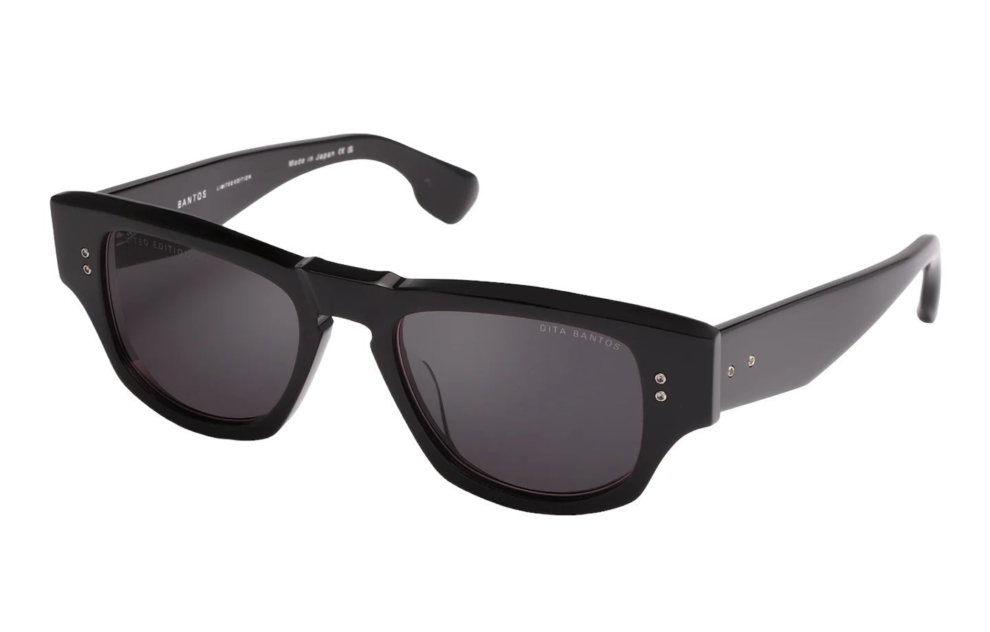 A pair of black, rectangular DITA BANTOS DTS723-A-01 sunglasses with dark lenses, featuring metallic accents on the front corners and an acetate frame fitted with straight temples.