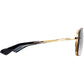 Side view of DITA Mach Six DTS121-62-01 eyeglasses with gold metal frames and black acetate temple arms, showcasing racing-inspired craftsmanship.