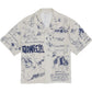 Explore the Domrebel Bearing Camp Collar Shirt Beige from DOM REBEL, a short-sleeve gem adorned with cartoon-style blue illustrations and text. Made from a premium blend of Rayon and Tencel, this shirt perfectly balances comfort and style.