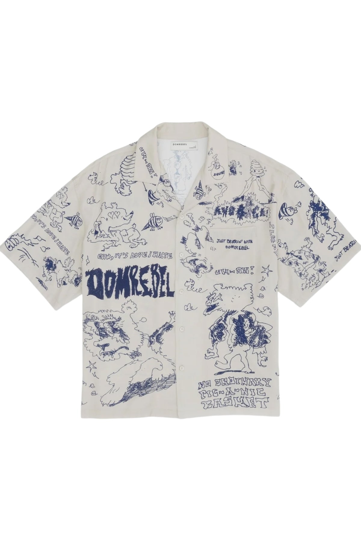 Explore the Domrebel Bearing Camp Collar Shirt Beige from DOM REBEL, a short-sleeve gem adorned with cartoon-style blue illustrations and text. Made from a premium blend of Rayon and Tencel, this shirt perfectly balances comfort and style.