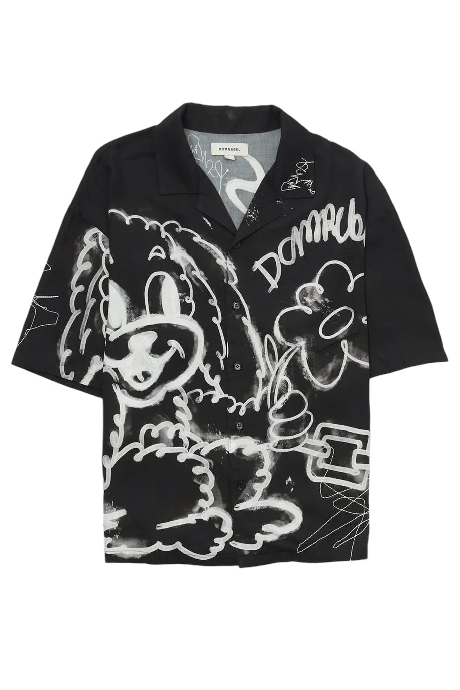 The Domrebel Chained Shirt Black by DOM REBEL showcases a full print of graffiti-style cartoons and script on a black short-sleeve button-up, made from a breathable rayon Tencel blend for both comfort and style.