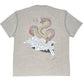 The Domrebel Conflict T-shirt Greige by DOM REBEL features a premium doodle graphic of a coiled dragon and abstract, spiky design with text, highlighting its unique artistry.